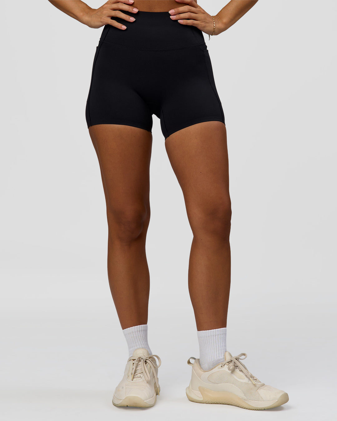 Woman wearing Fusion Bonded High-Rise 4" Short Pockets - Black | Model:Brylee | Size:XS - view 7