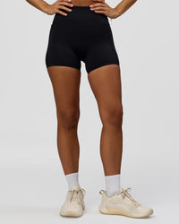 Woman wearing Fusion Bonded High-Rise 4" Short Pockets - Black | Model:Brylee | Size:XS | Thumbnail Index: 6