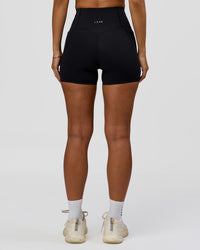 Woman wearing Fusion Bonded High-Rise 4" Short Pockets - Black | Model:Brylee | Size:XS | Thumbnail Index: 8