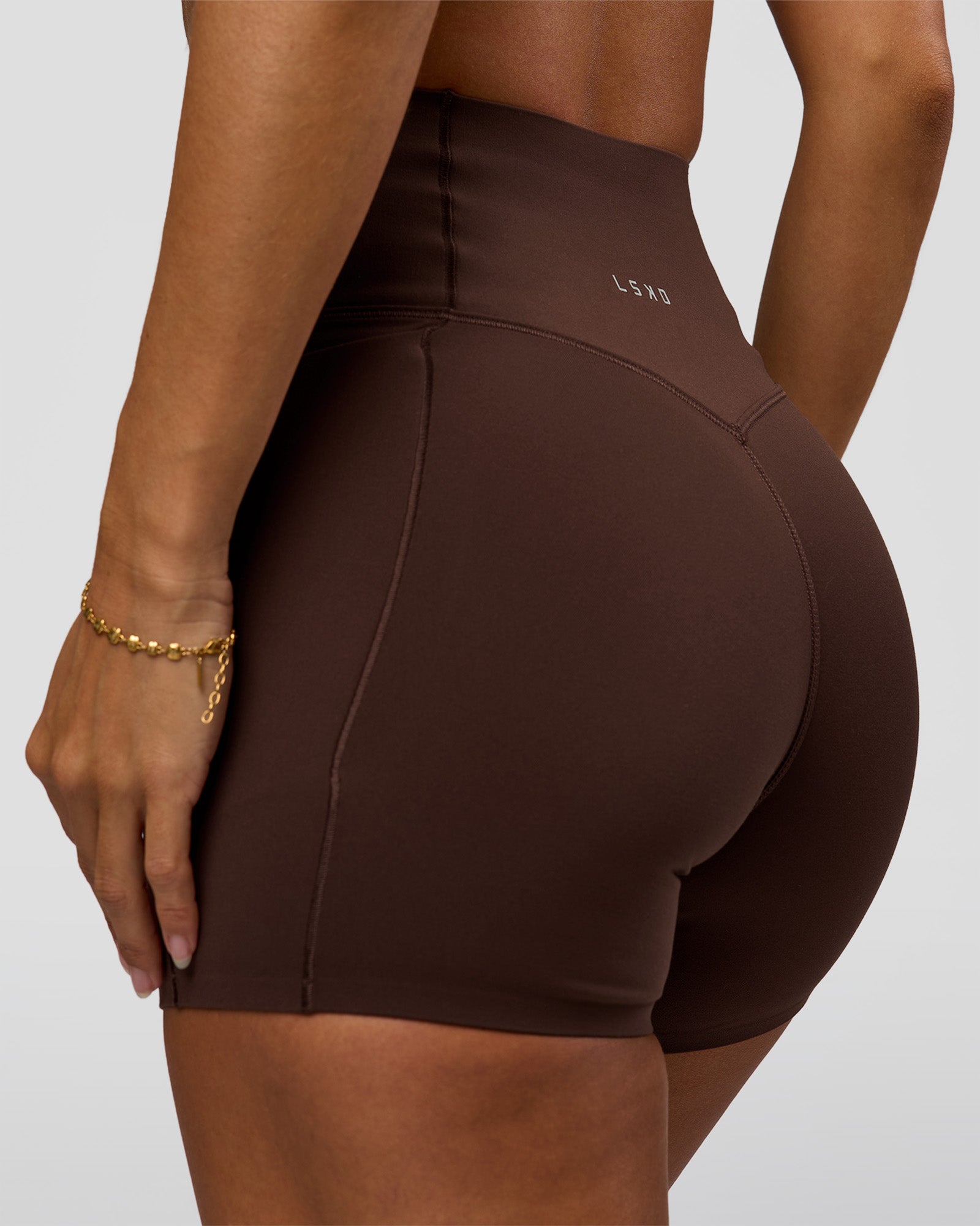 Woman wearing Fusion Bonded High-Rise 4" Short Pockets - Hot Chocolate | Model:Brylee | Size:XS