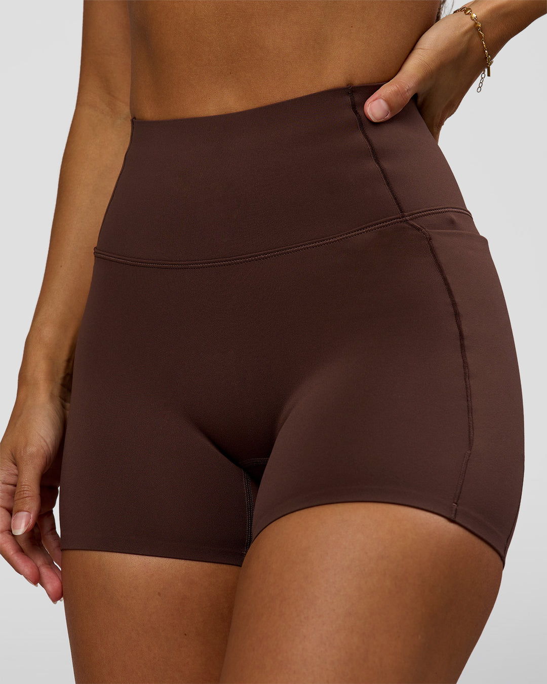 Woman wearing Fusion Bonded High-Rise 4" Short Pockets - Hot Chocolate | Model:Brylee | Size:XS - view 2