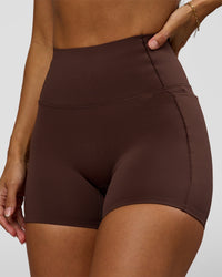 Woman wearing Fusion Bonded High-Rise 4" Short Pockets - Hot Chocolate | Model:Brylee | Size:XS | Thumbnail Index: 1