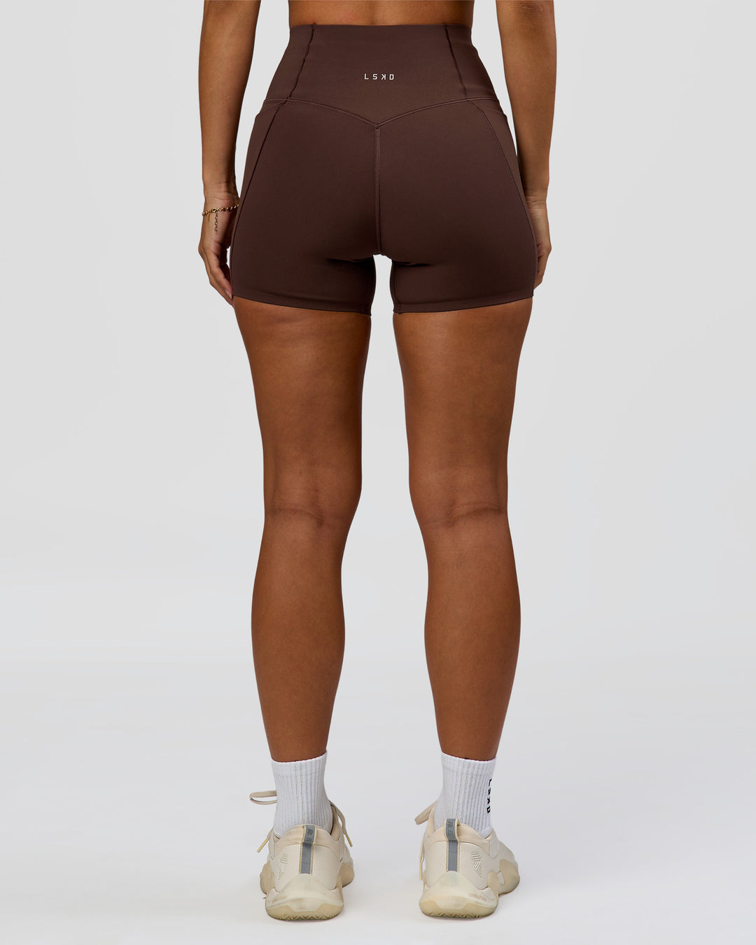 Woman wearing Fusion Bonded High-Rise 4" Short Pockets - Hot Chocolate | Model:Brylee | Size:XS - view 3