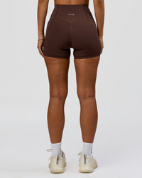 Woman wearing Fusion Bonded High-Rise 4" Short Pockets - Hot Chocolate | Model:Brylee | Size:XS | Thumbnail Index: 2