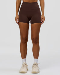 Woman wearing Fusion Bonded High-Rise 4" Short Pockets - Hot Chocolate | Model:Brylee | Size:XS | Thumbnail Index: 4
