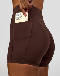 Woman wearing Fusion Bonded High-Rise 4" Short Pockets - Hot Chocolate | Model:Brylee | Size:XS | Thumbnail Index: 6