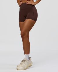 Woman wearing Fusion Bonded High-Rise 4" Short Pockets - Hot Chocolate | Model:Brylee | Size:XS | Thumbnail Index: 8