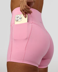 Woman wearing Fusion Bonded High-Rise 4" Short Pockets - Pink Rose | Model:Brylee | Size:XS | Thumbnail Index: 6