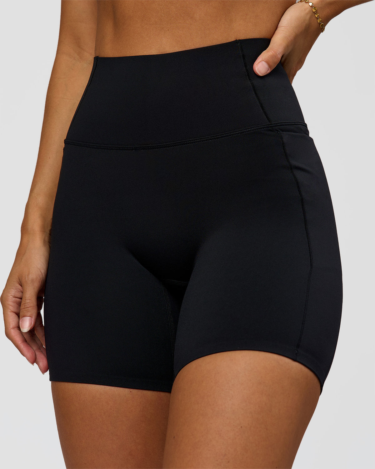 Woman wearing Fusion Bonded High-Rise 6" Short Pockets - Black | Model:Brylee | Size:XS