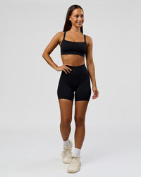 Woman wearing Fusion Bonded High-Rise 6" Short Pockets - Black | Model:Brylee | Size:XS | Thumbnail Index: 3