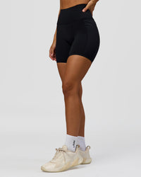 Woman wearing Fusion Bonded High-Rise 6" Short Pockets - Black | Model:Brylee | Size:XS | Thumbnail Index: 7