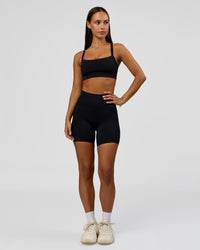 Woman wearing Fusion Bonded High-Rise 6" Short Pockets - Black | Model:Brylee | Size:XS | Thumbnail Index: 4