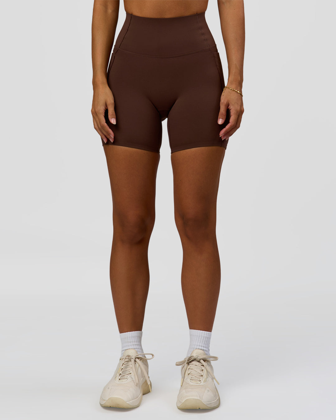 Woman wearing Fusion Bonded High-Rise 6" Short Pockets - Hot Chocolate | Model:Brylee | Size:XS - view 2