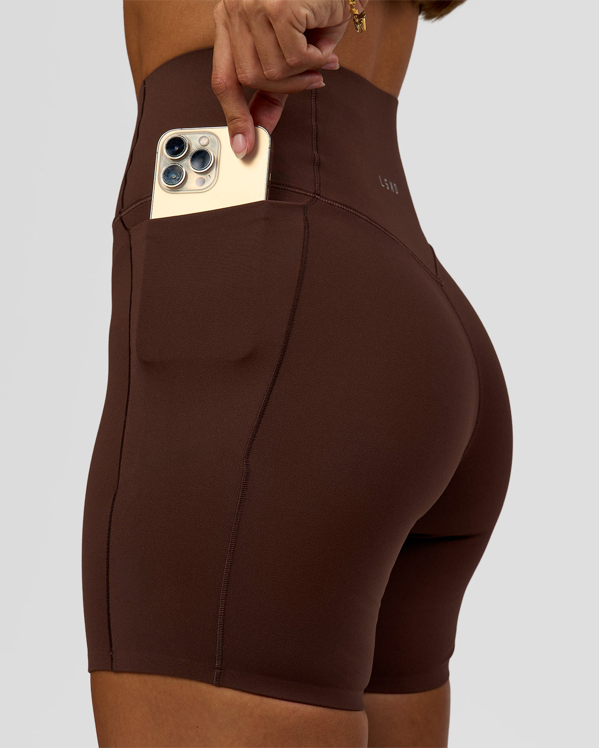 Woman wearing Fusion Bonded High-Rise 6" Short Pockets - Hot Chocolate | Model:Brylee | Size:XS - view 1