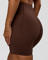 Woman wearing Fusion Bonded High-Rise 6" Short Pockets - Hot Chocolate | Model:Brylee | Size:XS | Thumbnail Index: 5