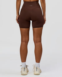 Woman wearing Fusion Bonded High-Rise 6" Short Pockets - Hot Chocolate | Model:Brylee | Size:XS | Thumbnail Index: 6
