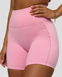 Woman wearing Fusion Bonded High-Rise 6" Short Pockets - Pink Rose | Model:Brylee | Size:XS | Thumbnail Index: 1
