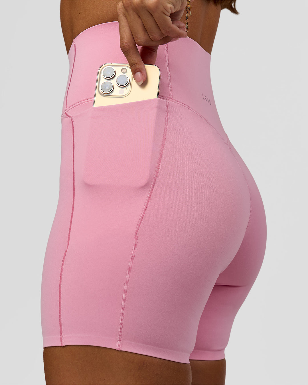 Woman wearing Fusion Bonded High-Rise 6" Short Pockets - Pink Rose | Model:Brylee | Size:XS - view 3