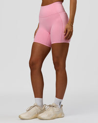 Woman wearing Fusion Bonded High-Rise 6" Short Pockets - Pink Rose | Model:Brylee | Size:XS | Thumbnail Index: 6