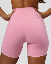 Woman wearing Fusion Bonded High-Rise 6" Short Pockets - Pink Rose | Model:Brylee | Size:XS | Thumbnail Index: 0