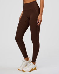 Woman wearing Fusion Bonded High-Rise Full Length Legging Pockets - Hot Chocolate | Model:Brylee | Size:XS | Thumbnail Index: 0