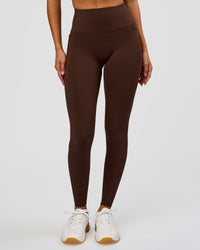Woman wearing Fusion Bonded High-Rise Full Length Legging Pockets - Hot Chocolate | Model:Brylee | Size:XS | Thumbnail Index: 1