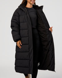 Woman wearing Go-To Puffer Long Jacket - Black | Model:Brylee | Size:XS | Thumbnail Index: 9