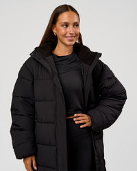 Woman wearing Go-To Puffer Long Jacket - Black | Model:Brylee | Size:XS | Thumbnail Index: 7