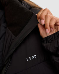 Woman wearing Go-To Puffer Long Jacket - Black | Model:Brylee | Size:XS | Thumbnail Index: 3