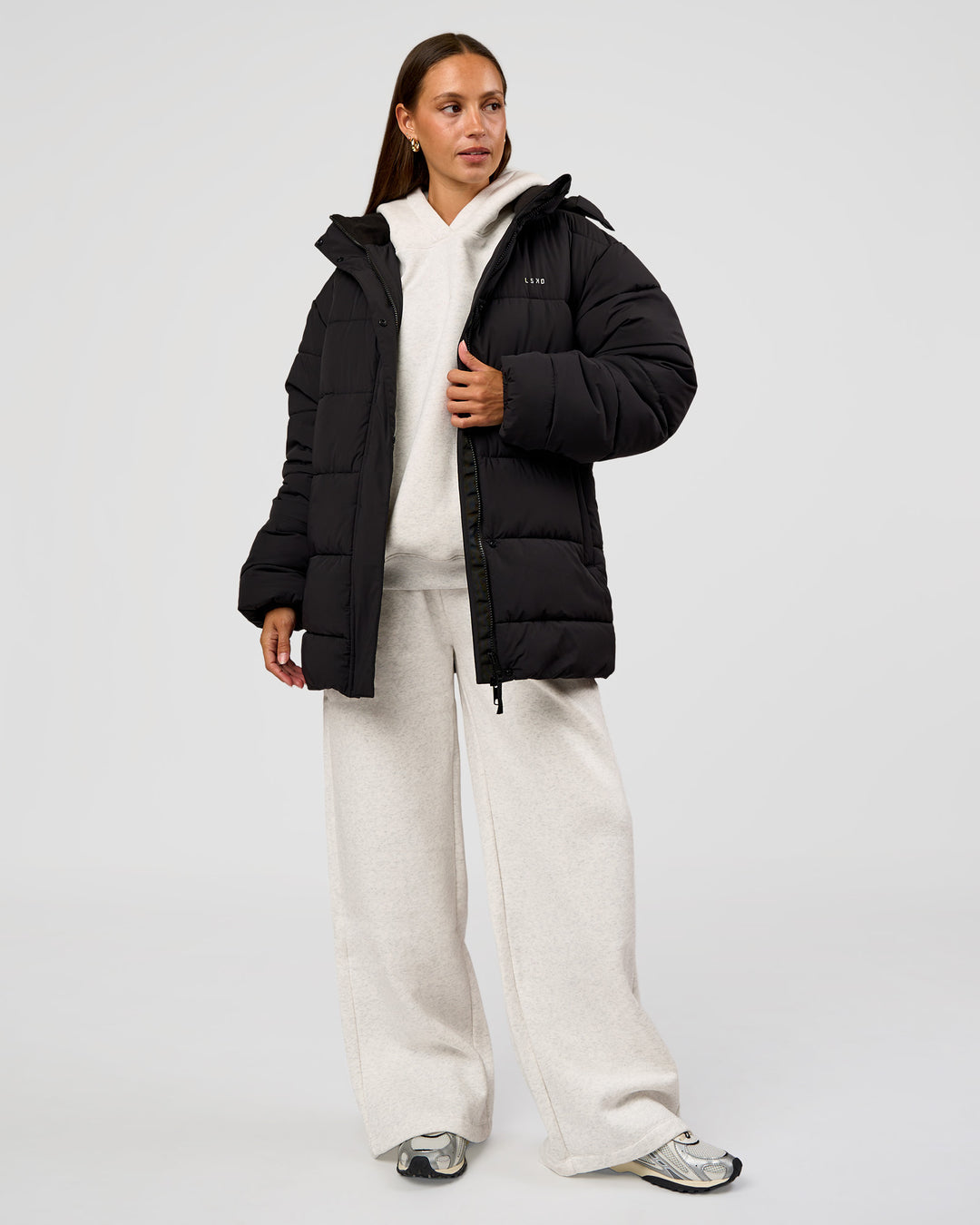 Woman wearing Go-To Puffer Mid Jacket - Black | Model:Brylee | Size:XS - view 3