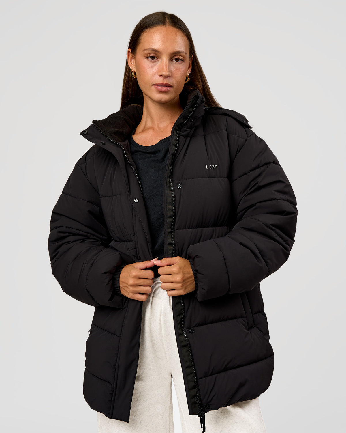 Woman wearing Go-To Puffer Mid Jacket - Black | Model:Brylee | Size:XS