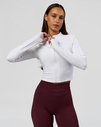 Woman wearing Sculpt Full Zip Long Sleeve Top - White | Model:Brylee | Size:XS | Thumbnail Index: 0