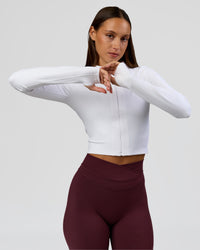 Woman wearing Sculpt Full Zip Long Sleeve Top - White | Model:Brylee | Size:XS | Thumbnail Index: 12