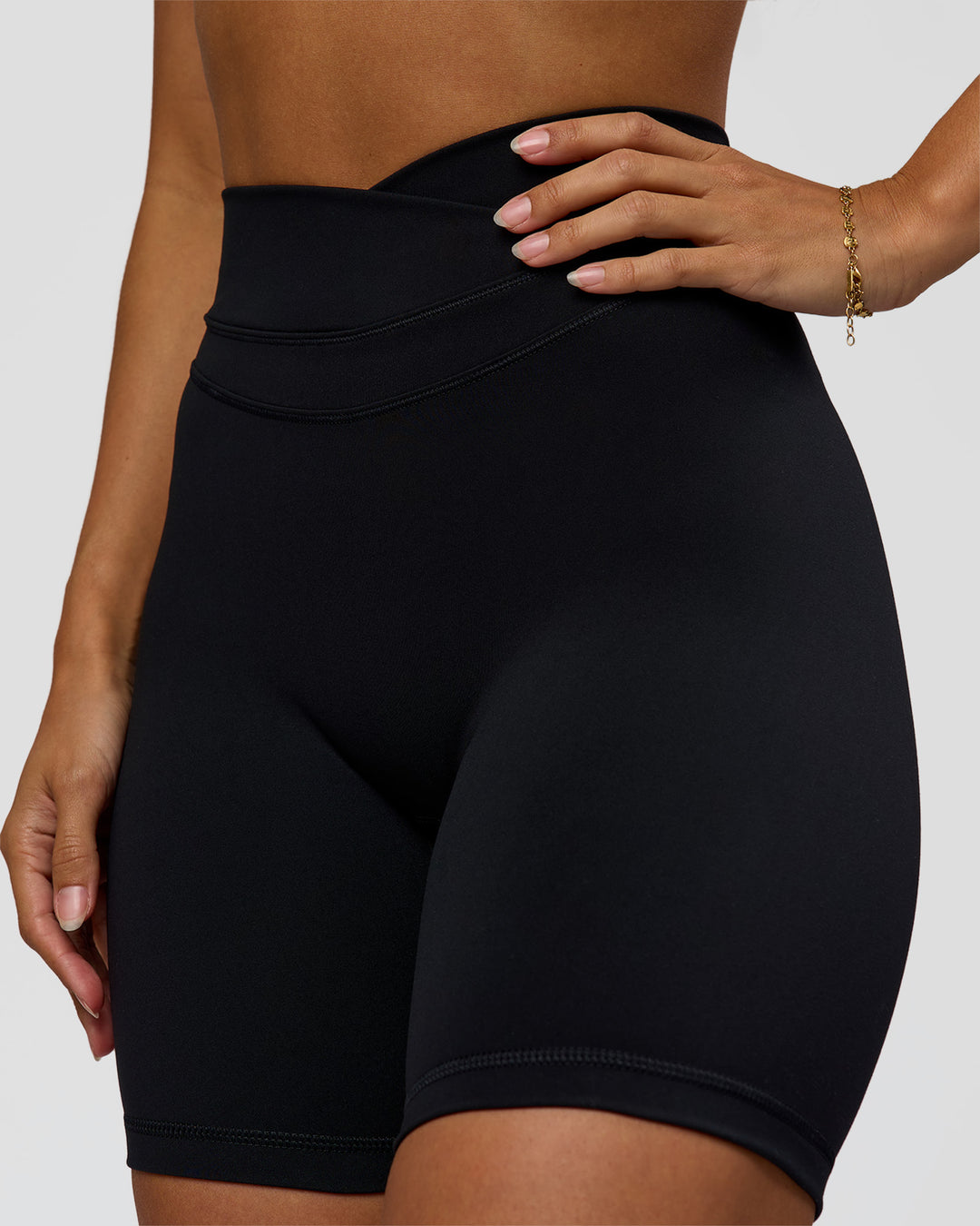 Woman wearing Solstice High-Rise 6" Short - Black | Model:Brylee | Size:XS - view 1