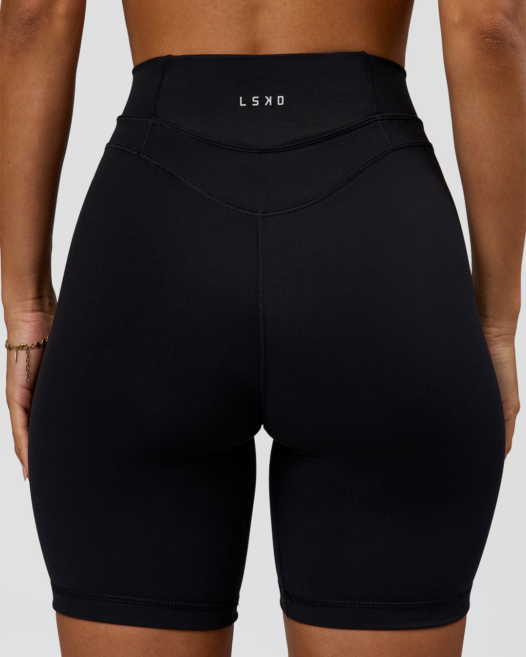 Woman wearing Solstice High-Rise 6" Short - Black | Model:Brylee | Size:XS - view 9