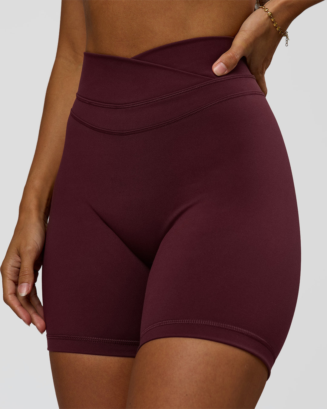 Woman wearing Solstice High-Rise 6" Short - Cherry Lacquer | Model:Brylee | Size:XS - view 1
