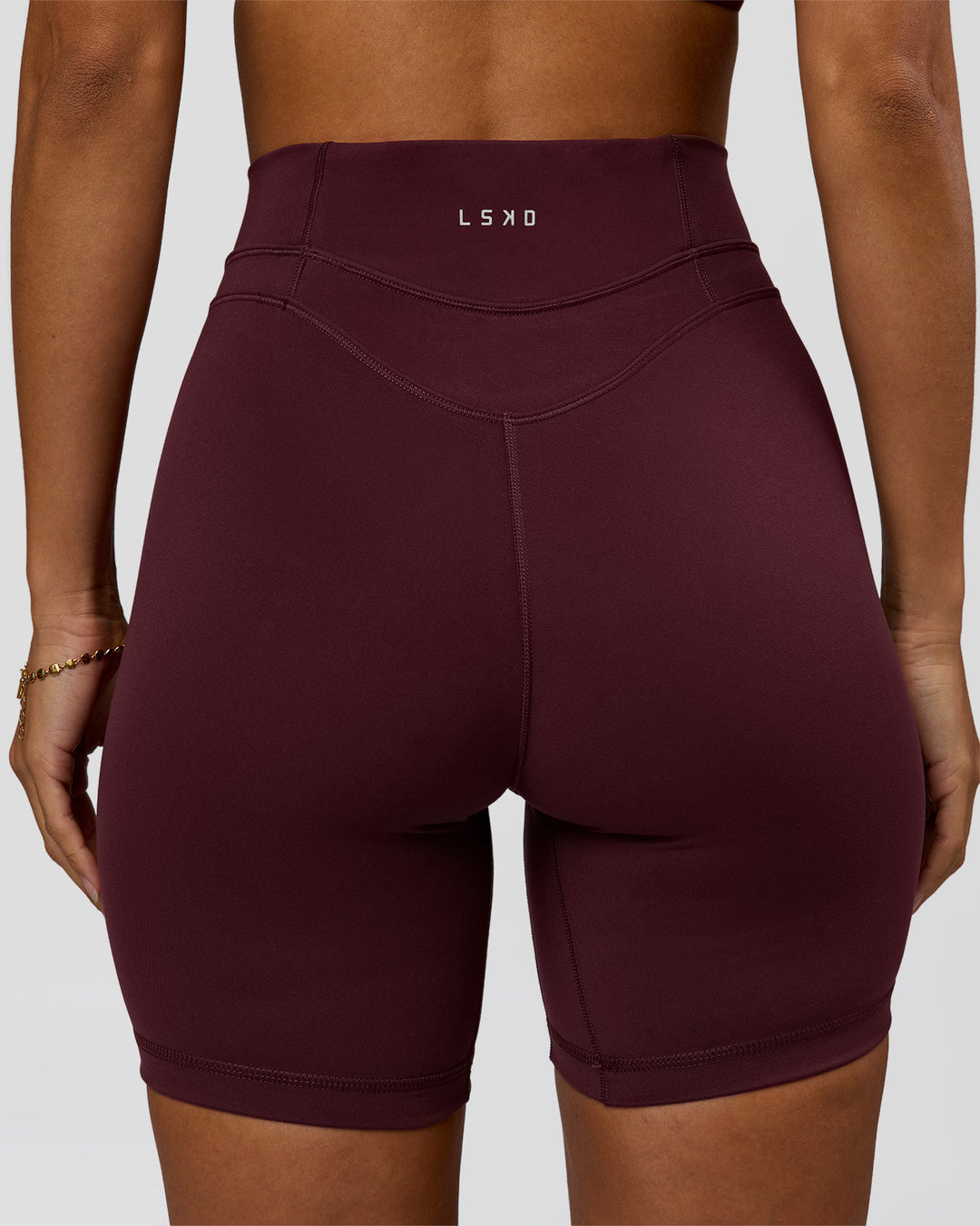 Woman wearing Solstice High-Rise 6" Short - Cherry Lacquer | Model:Brylee | Size:XS - view 4
