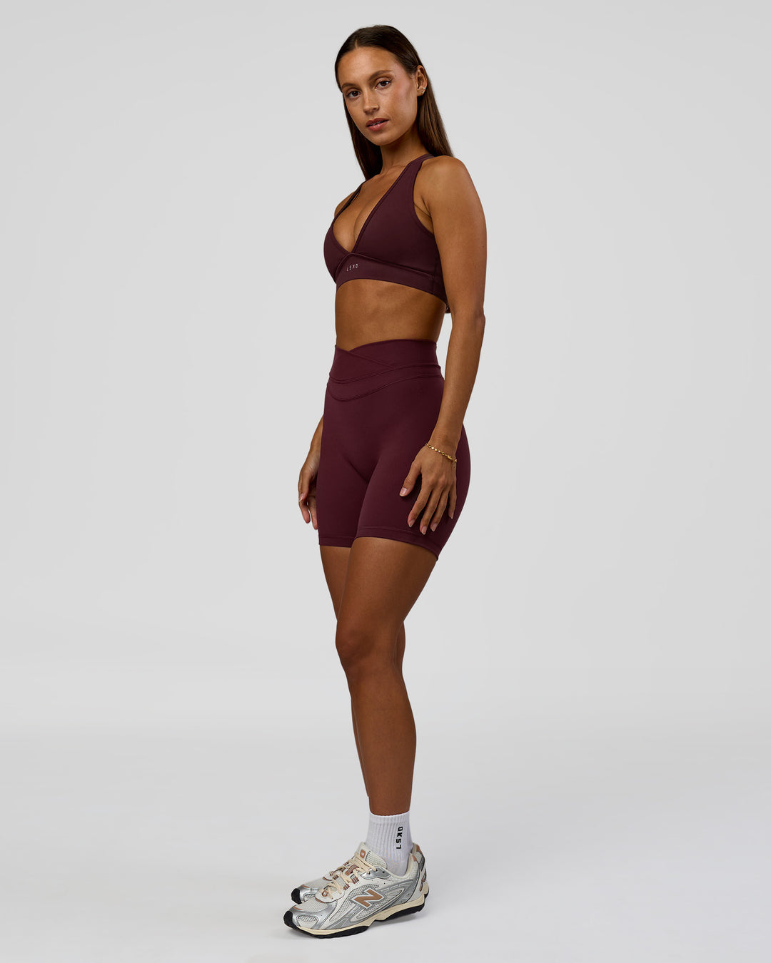 Woman wearing Solstice High-Rise 6" Short - Cherry Lacquer | Model:Brylee | Size:XS - view 6