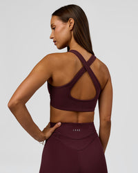 Woman wearing Stamina Sports Bra - Cherry Lacquer | Model:Brylee | Size:XS | Thumbnail Index: 1