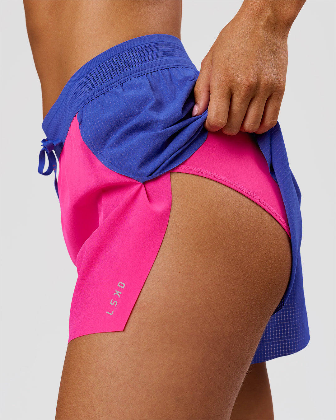 Woman wearing Accelerate 3" High-Rise Running Short - Power Cobalt-Ultra Pink | Model:Charli | Size:XS - view 7