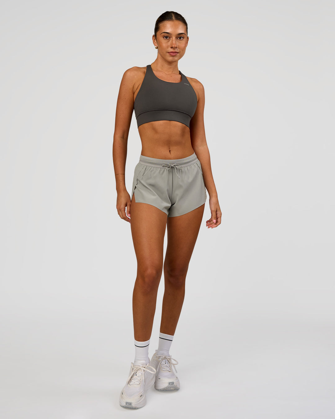 Woman wearing Accelerate 3" Mid-Rise Running Short - Alloy | Model:Charli | Size:XS - view 2