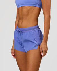 Woman wearing Accelerate 3" Mid-Rise Running Short - Bluebell | Model:Charli | Size:XS | Thumbnail Index: 1