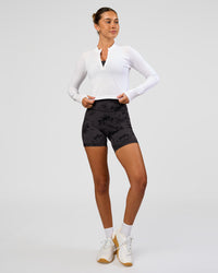 Woman wearing AeroFLX+ Long Sleeve Skimmer Half Zip - White/White | Model:Charli | Size:XS | Thumbnail Index: 2