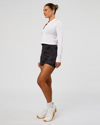 Woman wearing AeroFLX+ Long Sleeve Skimmer Half Zip - White/White | Model:Charli | Size:XS | Thumbnail Index: 3