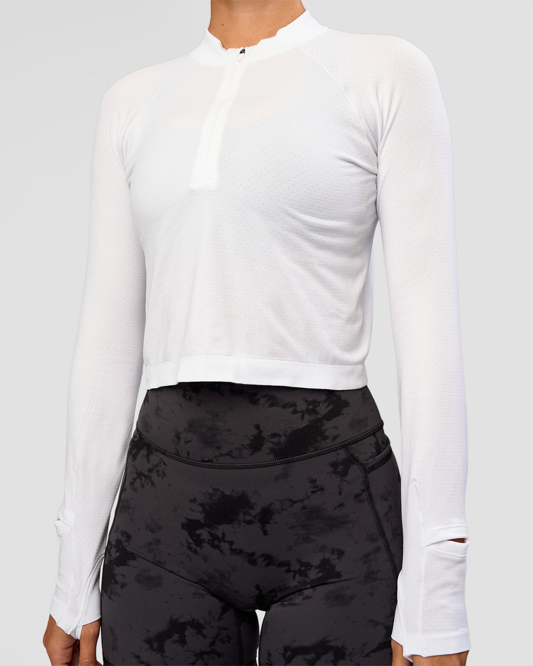 Woman wearing AeroFLX+ Long Sleeve Skimmer Half Zip - White/White | Model:Charli | Size:XS - view 5