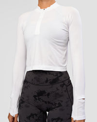 Woman wearing AeroFLX+ Long Sleeve Skimmer Half Zip - White/White | Model:Charli | Size:XS | Thumbnail Index: 4