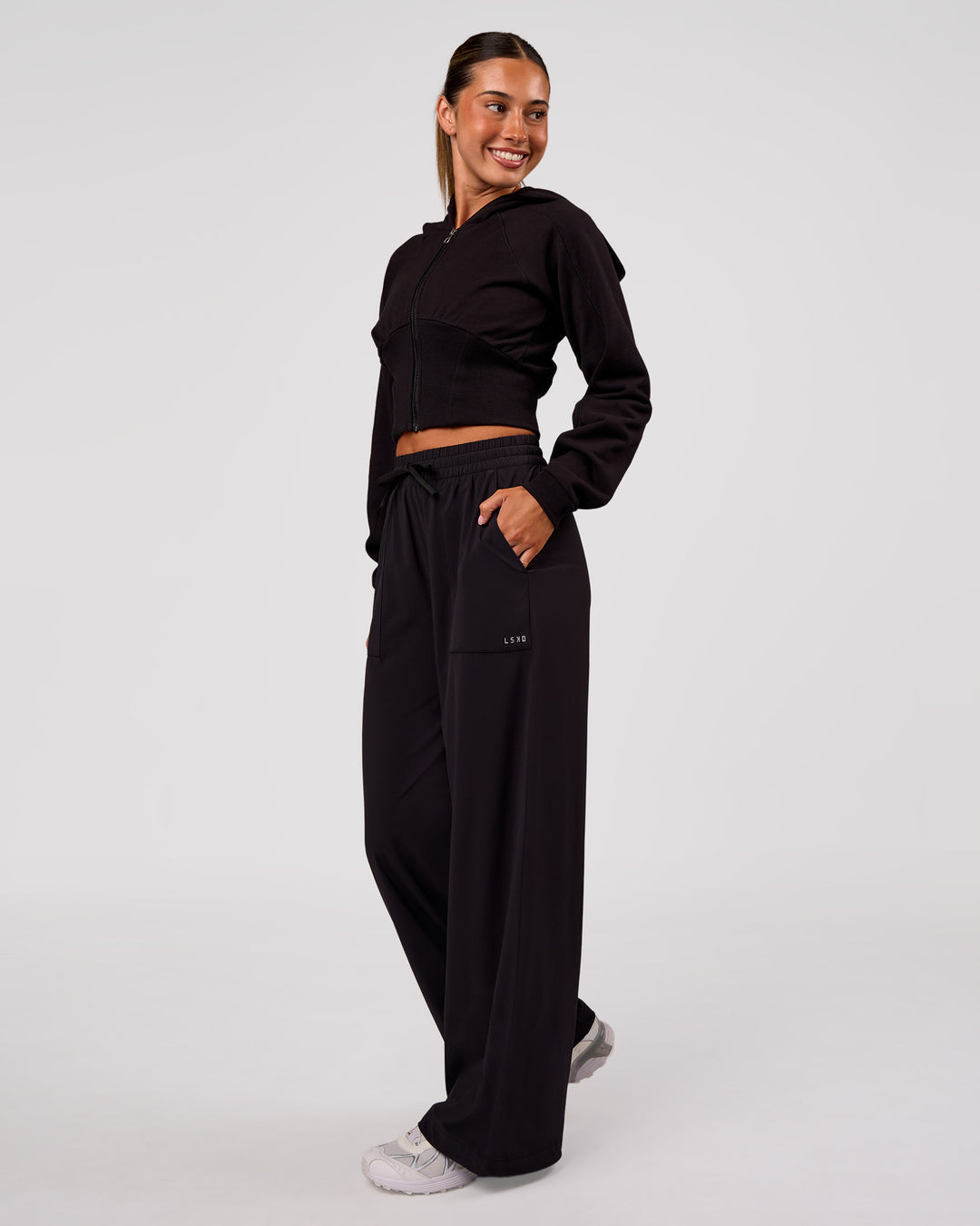 Woman wearing Bend Woven Pant - Black | Model:Charli | Size:XS - view 1