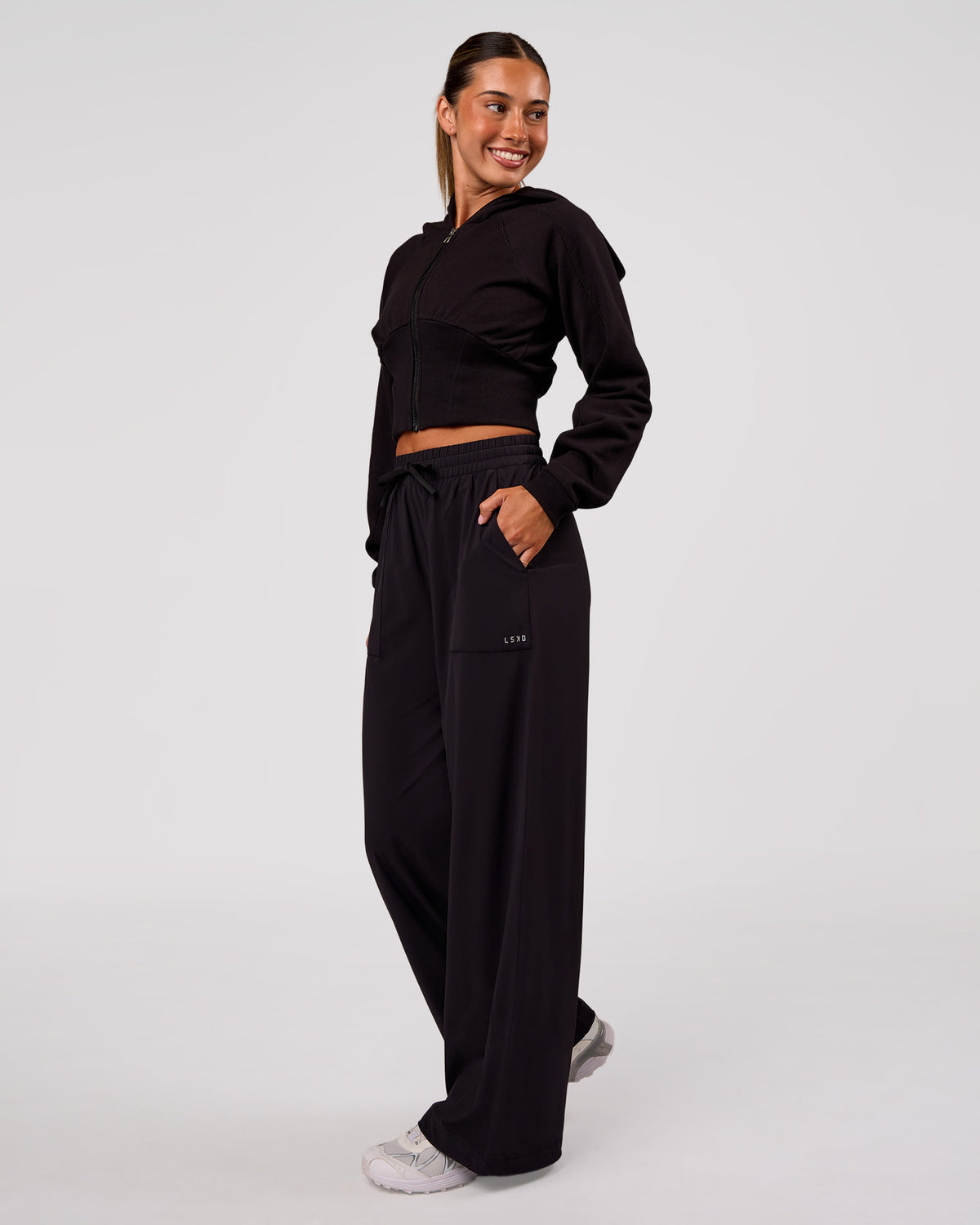 Woman wearing Bend Woven Pant - Black | Model:Charli | Size:XS