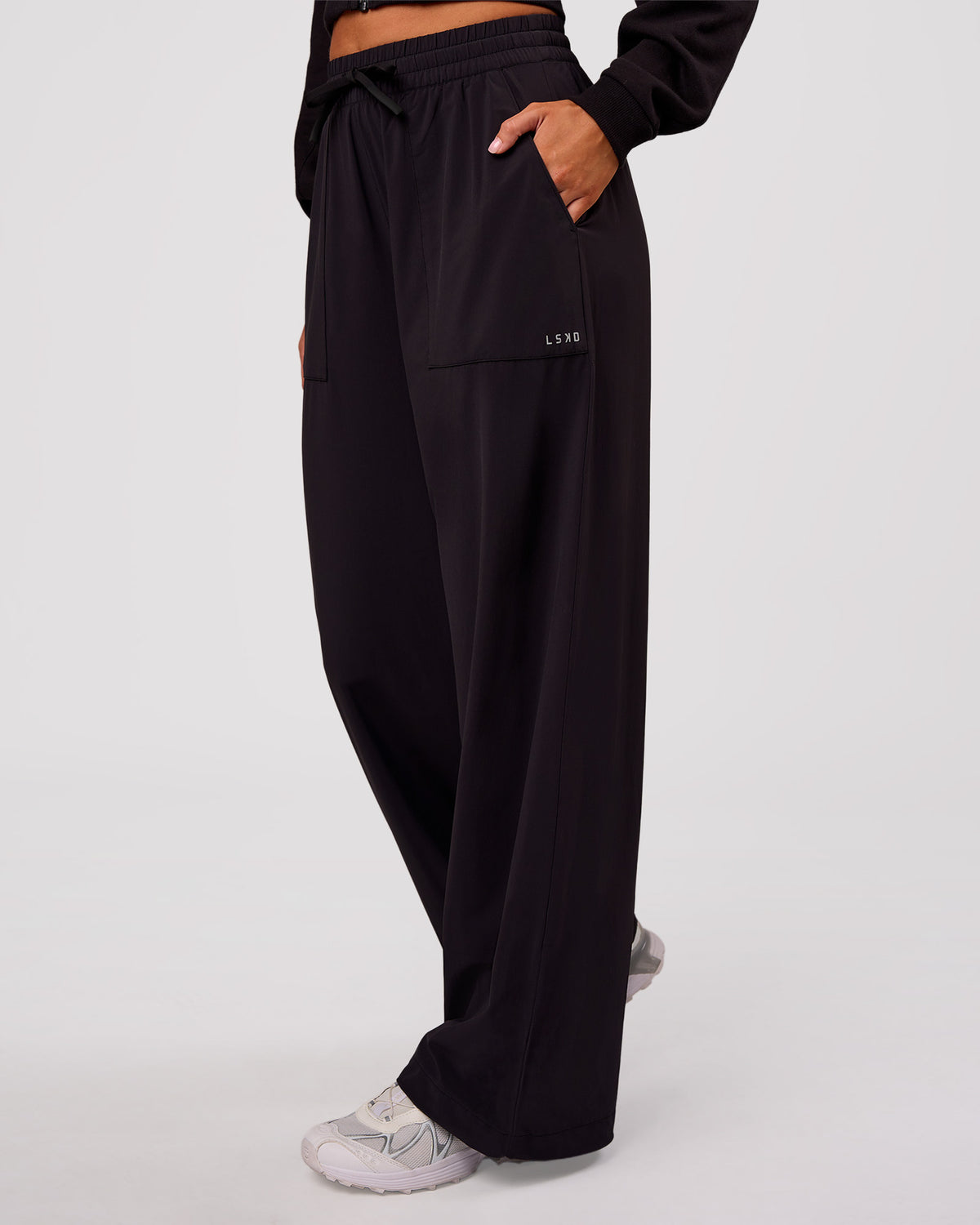 Woman wearing Bend Woven Pant - Black | Model:Charli | Size:XS