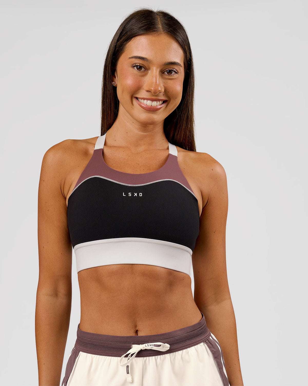 Woman wearing Elevated Accelerate Sports Bra - Black-Multi | Model:Charli | Size:XS - view 1